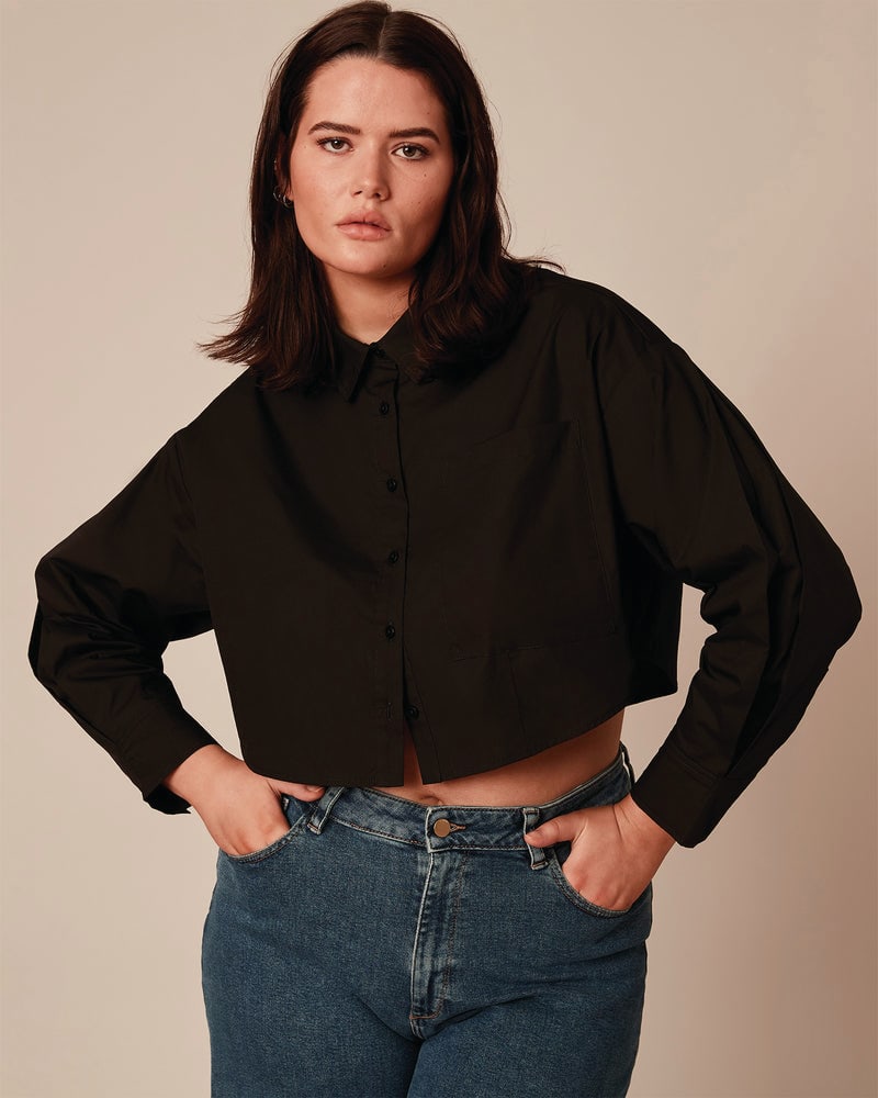 Front of a model wearing a plus size Tate Shirt in Black by 11 Honoré Collection. | dia_product_style_image_id:203972
